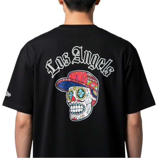 Person wearing a black 'Los Angels' shirt with a sugar skull graphic on a white background. 