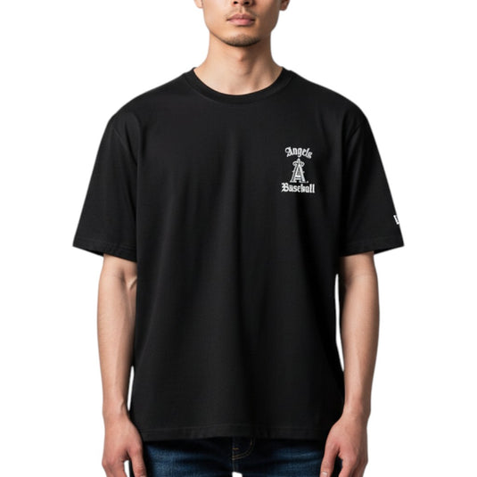 Person wearing a black 'Angels Baseball' shirt on a white background. 