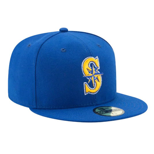 Royal blue Mariners alternate cap with a gold logo on a white background. 
