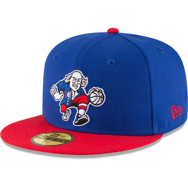 Load image into Gallery viewer, A piece of Philadelphia 76ers history, this fitted cap features an embroidered cartoon of Benjamin Franklin dribbling a basketball on the front in red, white, and blue on the back. Philadelphia’s favorite Founding Father is ballin’ in style on this iconic 6-panel 59FIFTY fitted cap from New Era.
