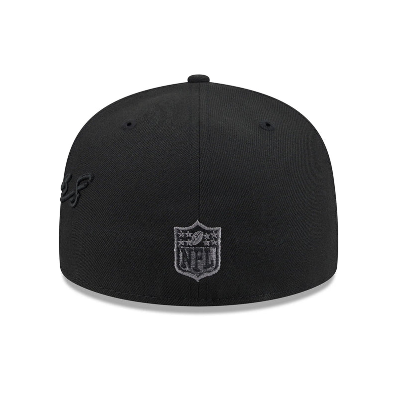 Load image into Gallery viewer, A black structured baseball cap featuring a NFL shield logo patch on the front and a subtle black embroidered script logo on the side, shown against a plain white background.
