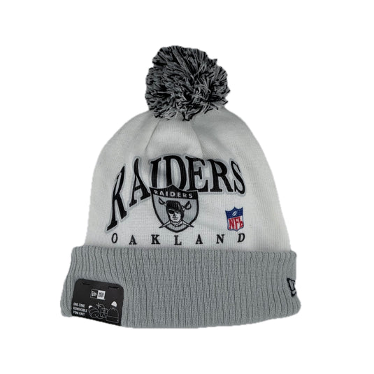 New Era NFL Oakland Raiders Team Spirit cuffed knit beanie with black and gray pom-pom. 