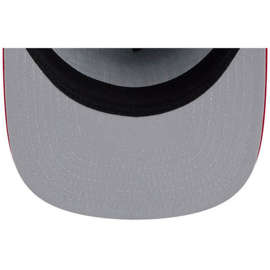 Close-up of the under visor of a cap with black sweatband on a white background
