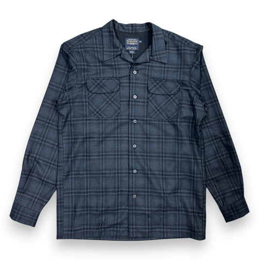 Black and blue plaid shirt on a white background