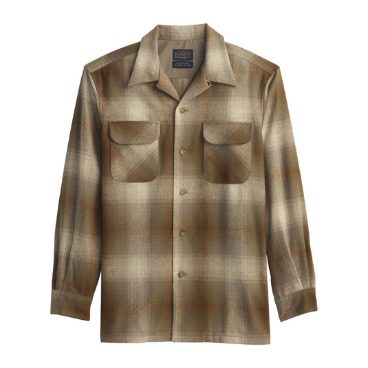 Tan and olive plaid board shirt on a white background