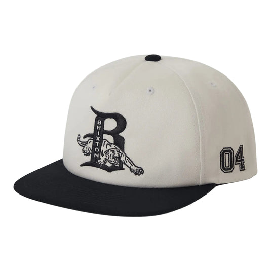 Beige and black cap with embroidered logo with a animal coming out of the 