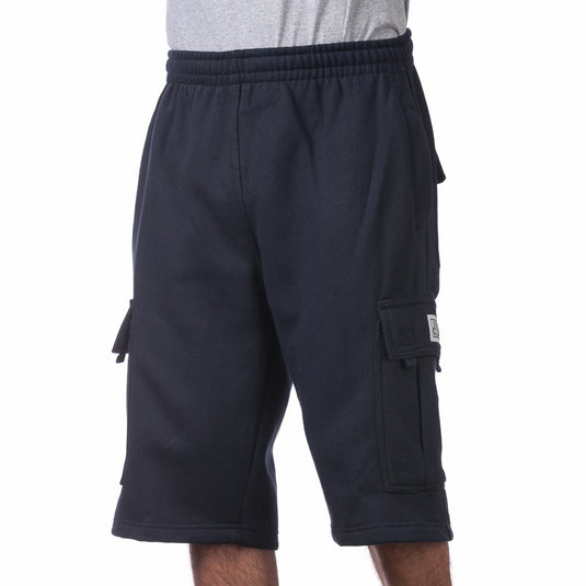 Navy cargo sweat shorts worn by a person on a white background
