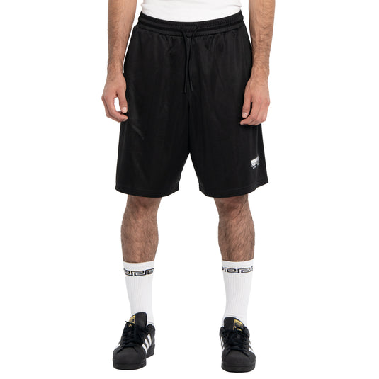 Person wearing black shorts with a brand logo on a white background
