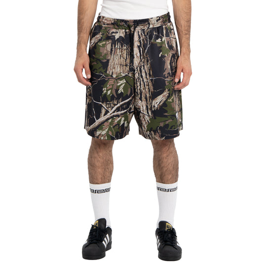 Person wearing camouflage shorts on a white background