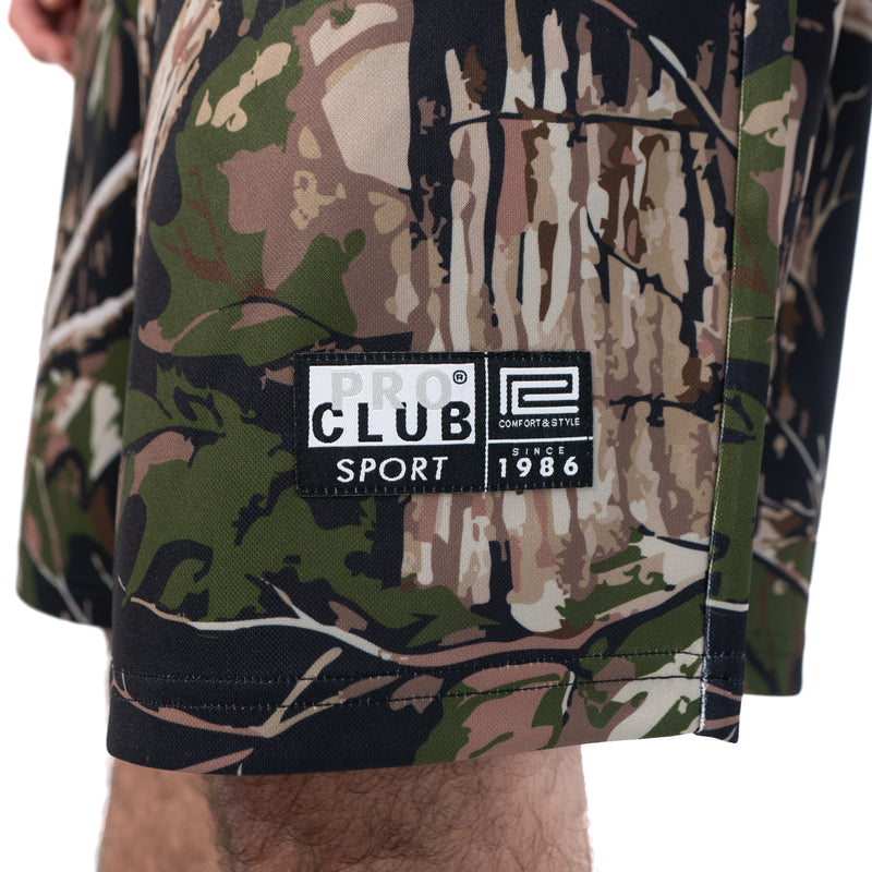 Load image into Gallery viewer, Camouflage shorts with a visible Pro Club brand label on a white background
