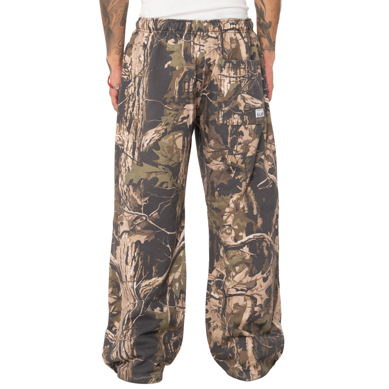 Load image into Gallery viewer, Camouflage pants on a white background
