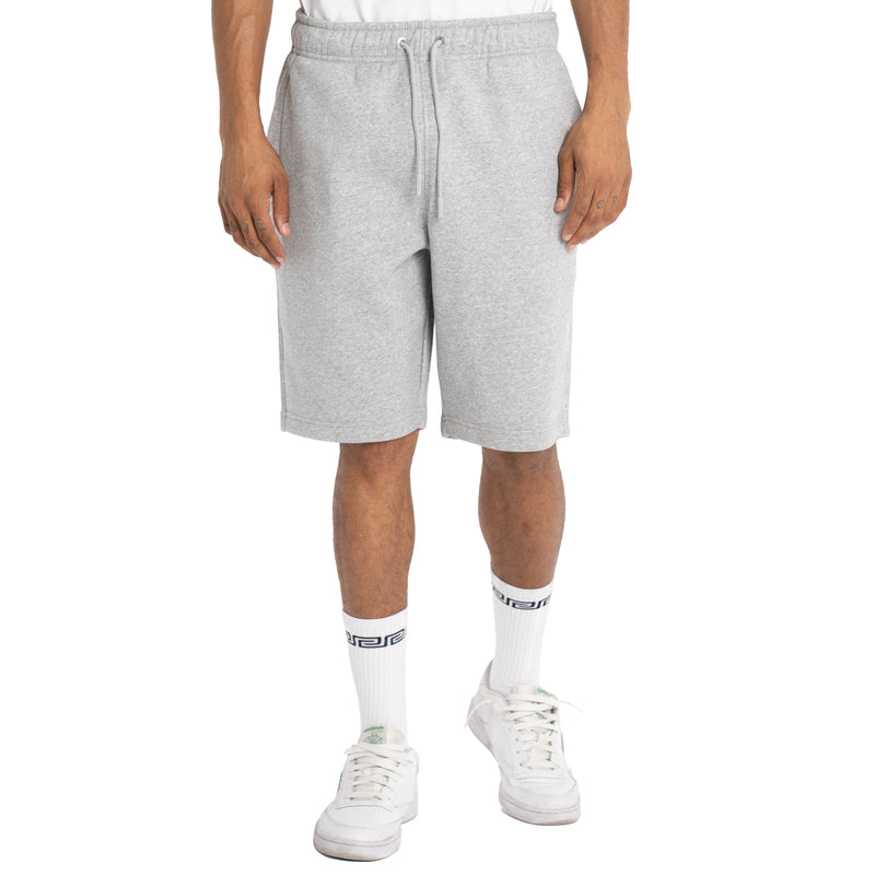 Load image into Gallery viewer, Person wearing heather gray sweat shorts with the same color drawstrings that sit at the knee on a white background
