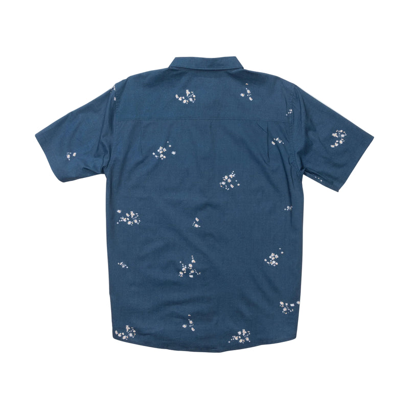 Load image into Gallery viewer, Navy blue shirt with white floral pattern on a white background

