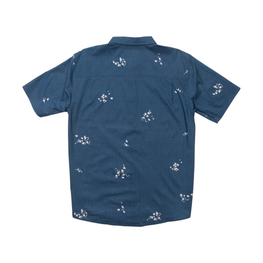 Navy blue shirt with white floral pattern on a white background