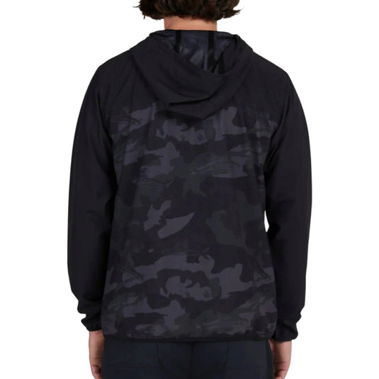 Black camouflage hoodie worn by a person on a white background