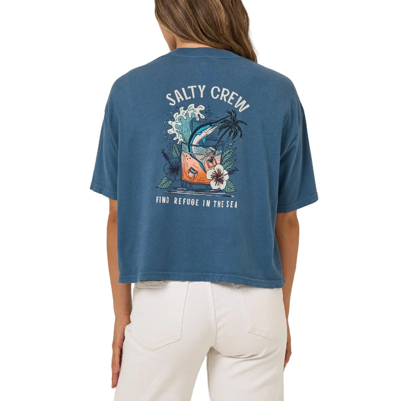 Load image into Gallery viewer, Person wearing a blue 'Salty Crew' t-shirt with a graphic design on the back against a beige background
