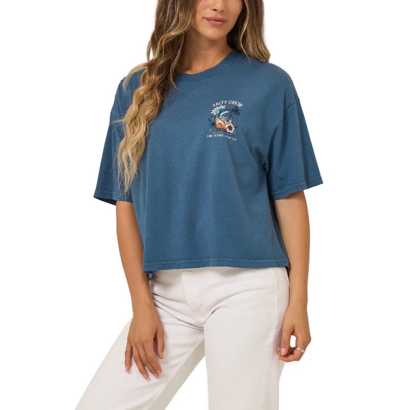 Load image into Gallery viewer, Woman wearing a blue t-shirt with a graphic design on a beige background
