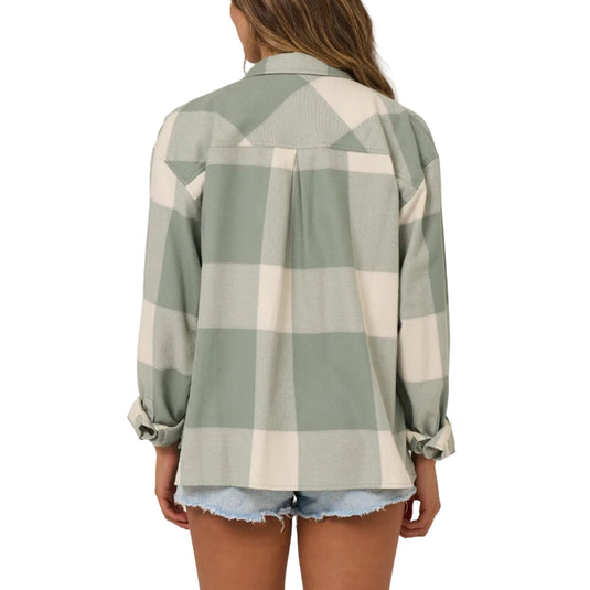 Person wearing a green and white checkered shirt on a plain background