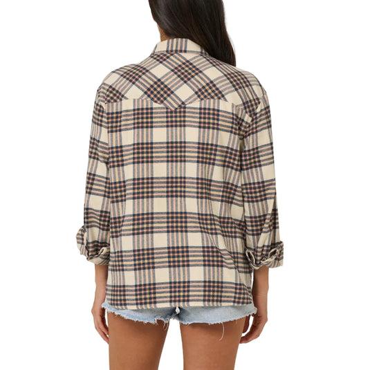 Person wearing a plaid shirt and denim shorts on a plain background