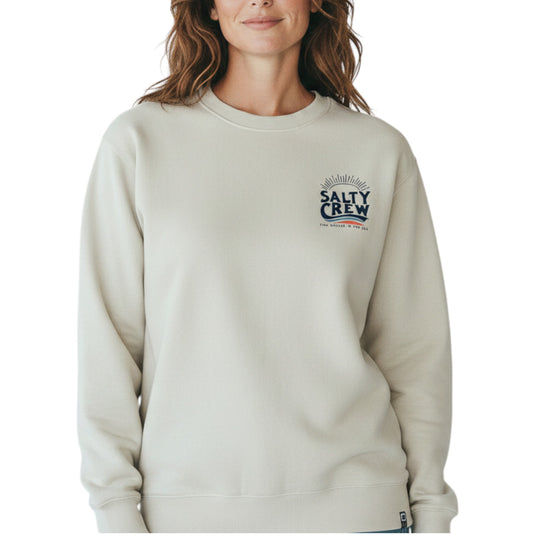 Person wearing a beige sweatshirt with Salty Crew logo on a white background