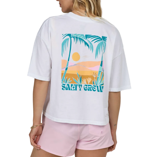 Person wearing a white t-shirt with a palm tree and beach design, labeled 'Salty Crew', on a plain background.