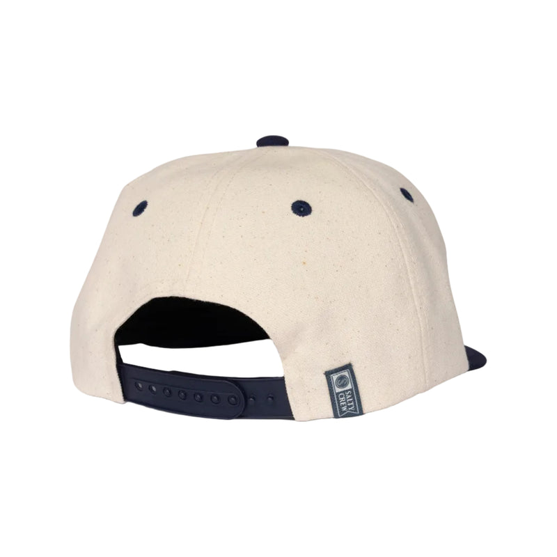 Load image into Gallery viewer, Beige snapback cap with navy accents on a white background
