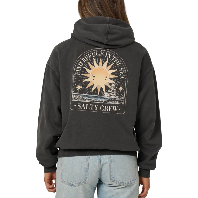 Load image into Gallery viewer, A woman viewed from the back wearing a dark charcoal gray hoodie with a large graphic print on the back. The graphic features a sun, stars, and the text 'FIND REFUGE IN THE SKY' and 'SALTY CREW'.
