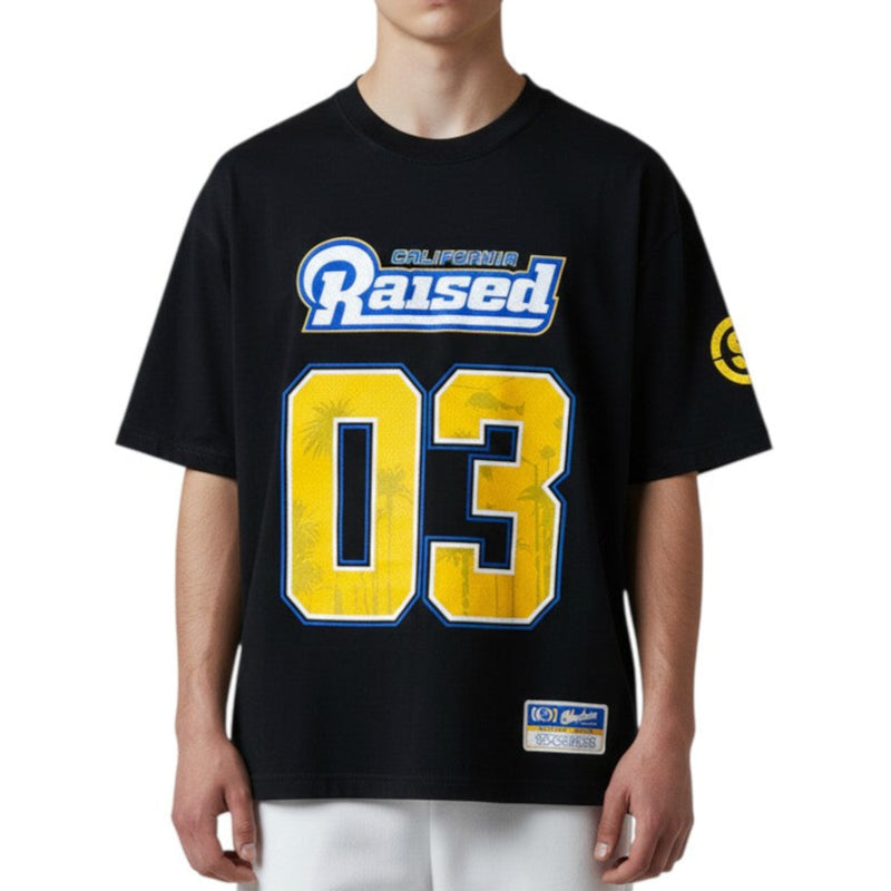 Load image into Gallery viewer, Person wearing a black t-shirt with yellow and blue text and numbers on a white background
