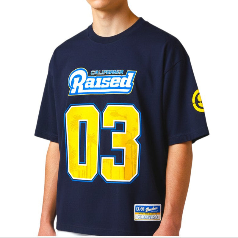 Load image into Gallery viewer, Person wearing a navy blue t-shirt with 'Raised' and number '03' on a white background
