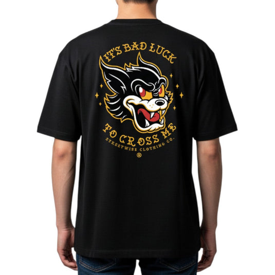 Black t-shirt with a graphic design and text on the back, worn by a person.