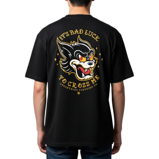 Black t-shirt with a graphic design on the back, worn by a person.