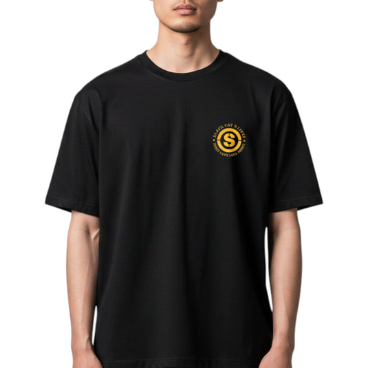 Person wearing a black t-shirt with a yellow logo on a white background
