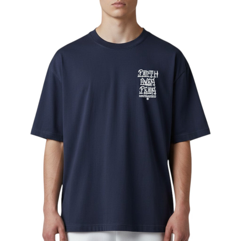 Load image into Gallery viewer, Person wearing a navy blue t-shirt with a logo on the chest against a white background
