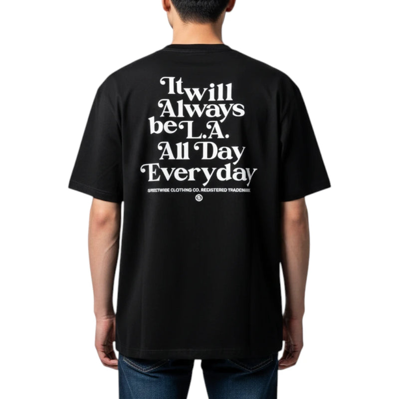 Load image into Gallery viewer, A man viewed from the back wearing a black t-shirt with a large white typographic graphic that reads 'It will Always be L.A.
