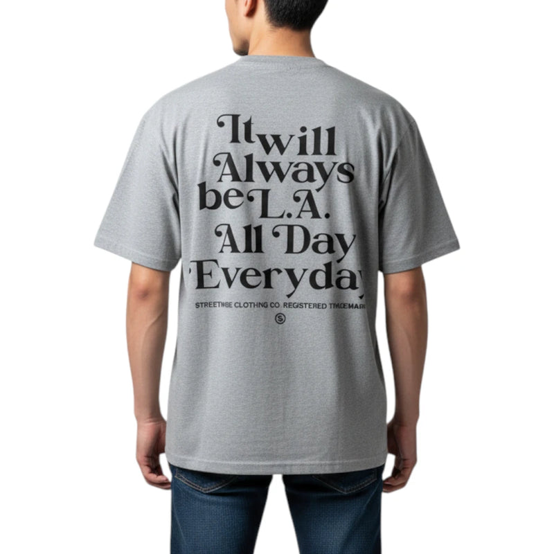 Load image into Gallery viewer, A man viewed from the back wearing a heather gray t-shirt with a large black typographic graphic on the back that reads 'It will Always be L.A.
