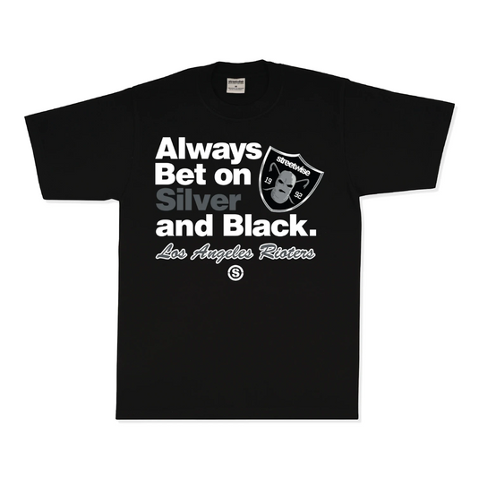 A black short-sleeve t-shirt with a graphic print on the front. The graphic features the text 'Always Bet on Silver and Black.