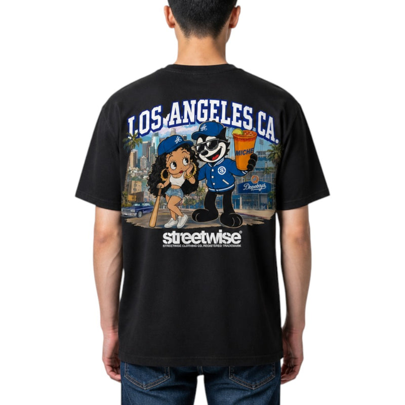Load image into Gallery viewer, A man viewed from behind wearing a black Streetwise Los Angeles graphic t-shirt with a large multicolor cartoon print on the back.

