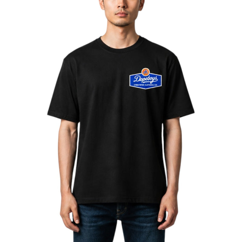 Load image into Gallery viewer, A man wearing a black short-sleeve t-shirt with a blue and white 'Dopeboys' logo on the left chest, paired with dark blue jeans, against a plain white background.
