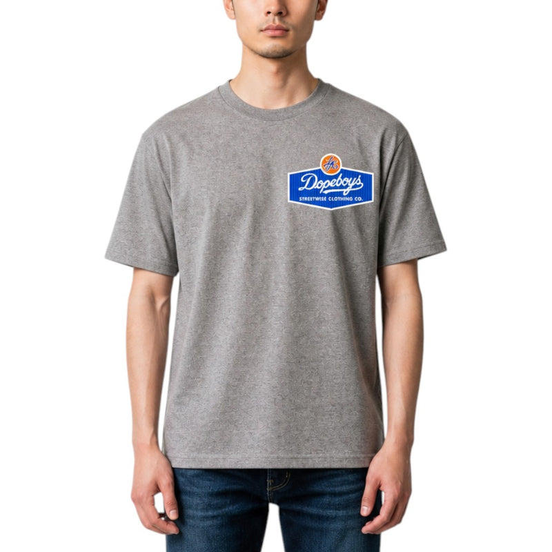 Load image into Gallery viewer, A man wearing a heather gray crewneck t-shirt with a blue and orange Dopey's All Purpose Clothing Co. logo on the left chest, paired with dark blue jeans, against a plain white background.
