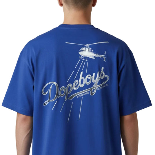 Person wearing a blue t-shirt with 'Dopeboys' and helicopter design on the back against a white background