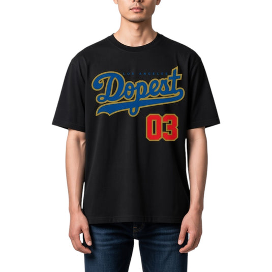 A man wearing a black t-shirt with a blue and yellow 'Dopest' graphic and red '03' text, paired with blue jeans, against a plain white background.