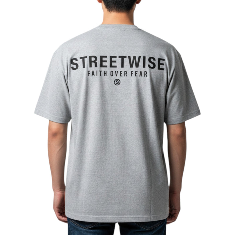 Load image into Gallery viewer, Gray t-shirt with 'Streetwise Faith Over Fear' text on the back, worn by a person.
