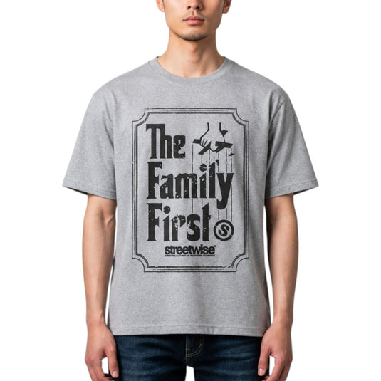 A man wearing a heather gray t-shirt with a distressed black graphic that reads 'The Family First' and 'streetwise' underneath, shown against a plain white background.