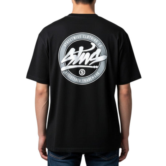 Black t-shirt with a logo on the back worn by a person, white background