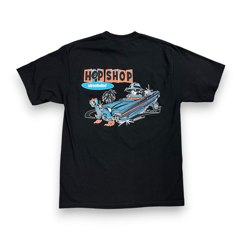 Load image into Gallery viewer, Black t-shirt with a graphic design on the back featuring a car and 'Hop Shop' text.
