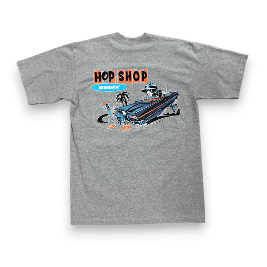 Gray t-shirt with a graphic design of a hot rod and 'Hop Shop' text on a white background