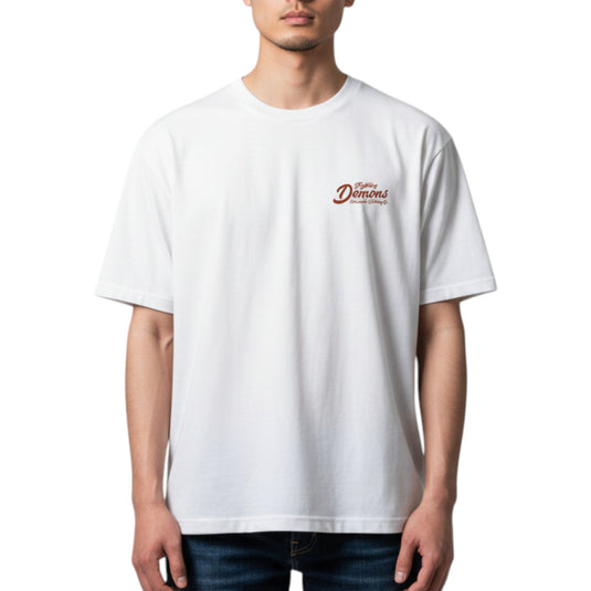 Person wearing a white t-shirt with a logo on the chest against a white background