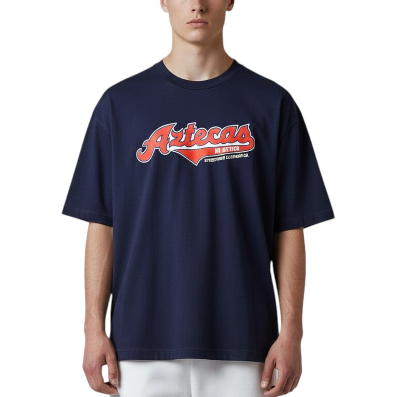 Load image into Gallery viewer, Person wearing a navy blue t-shirt with 'Aztecas' logo on a white background
