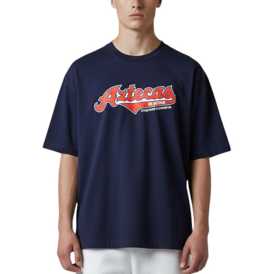 Person wearing a navy blue t-shirt with 'Aztecas' logo on a white background