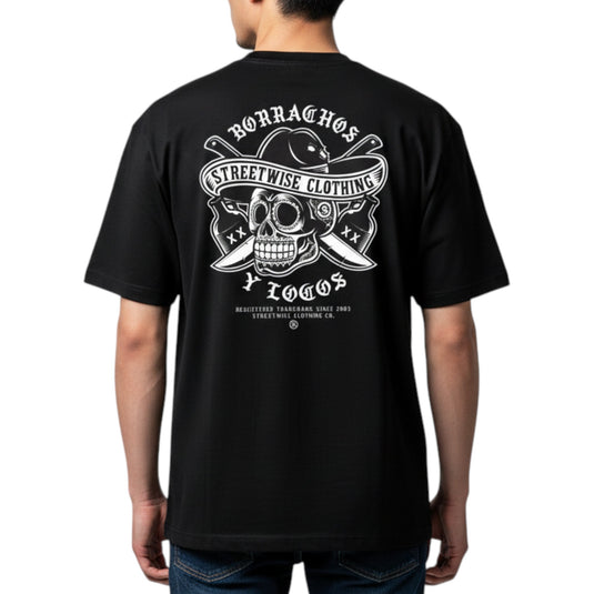 Black t-shirt with white graphic design on the back, featuring a skull and crossed swords, worn by a person.